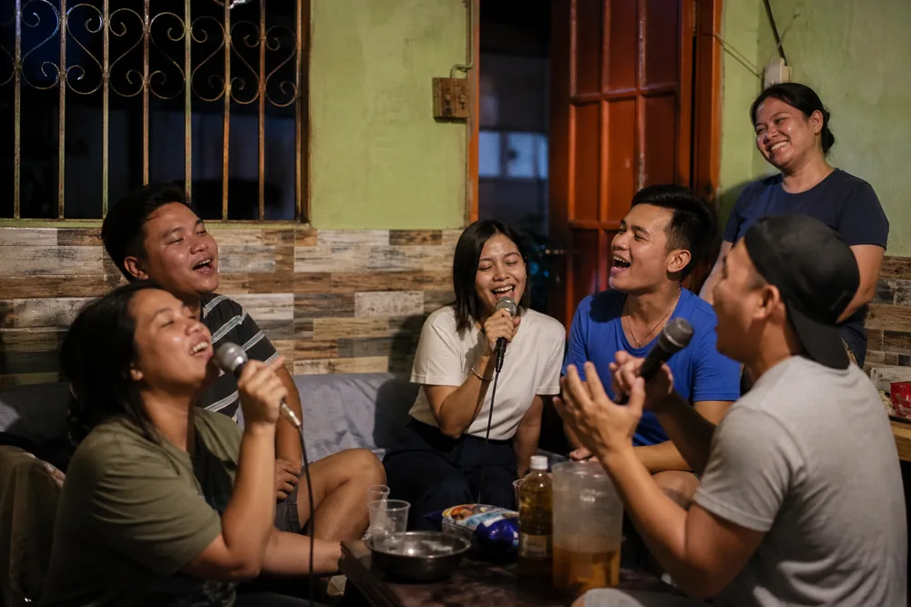 Friends singing karaoke together